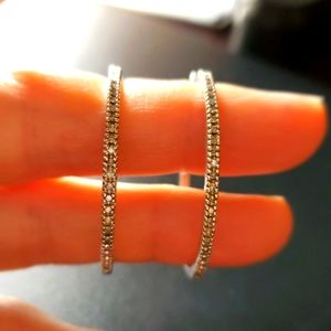 Sterling silver with real diamonds hoops.